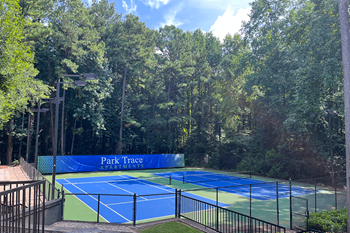 Lighted tennis court at park trace apartments